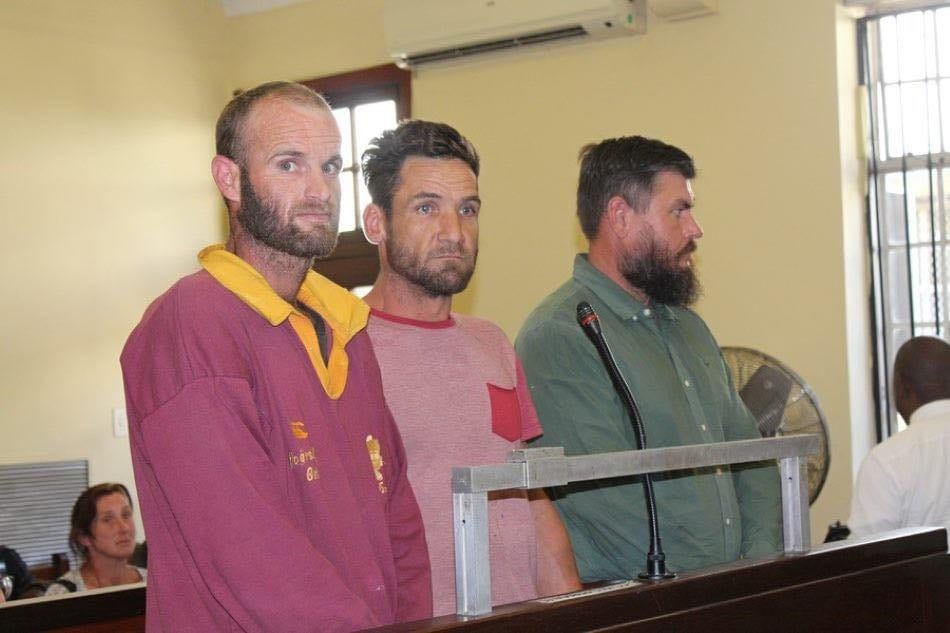 Three Accused Stand in Court After Murder Conviction